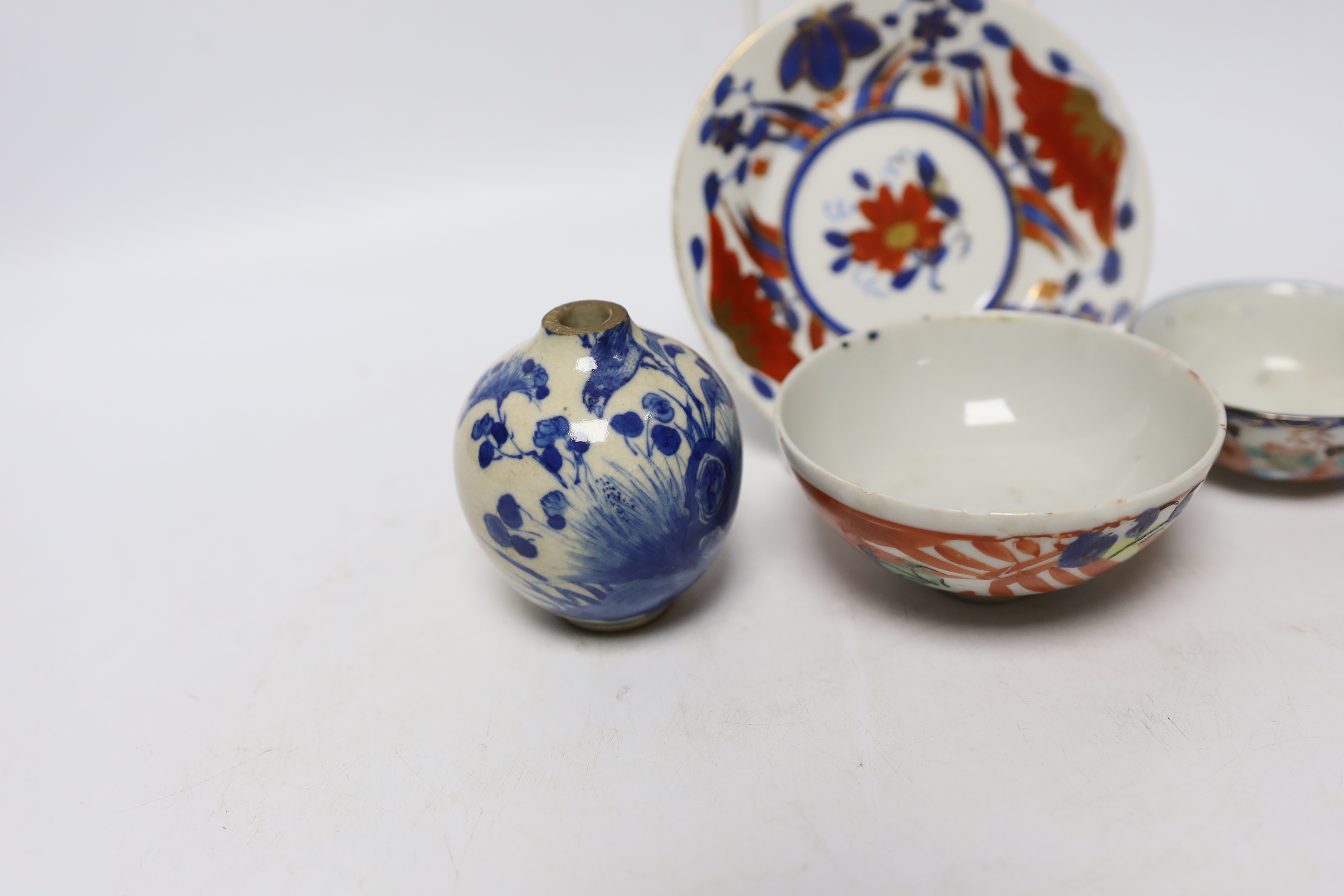 A Chinese soft paste porcelain miniature vase, two small bowls, and a small dish, vase 7cm (4)